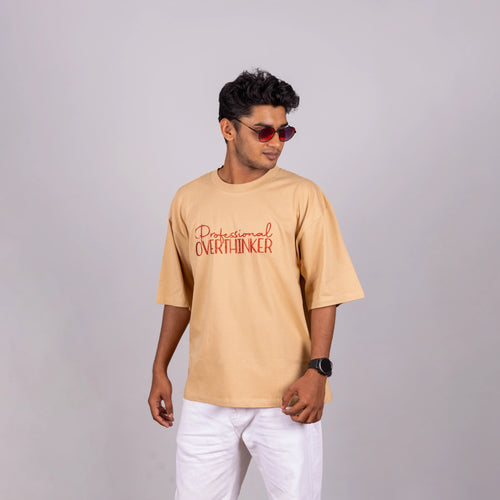 Side view of Oversized “Professional Overthinker” tee, showing loose fit and speech-starter text