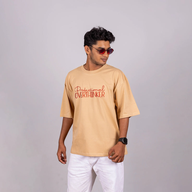 Side view of Oversized “Professional Overthinker” tee, showing loose fit and speech-starter text
