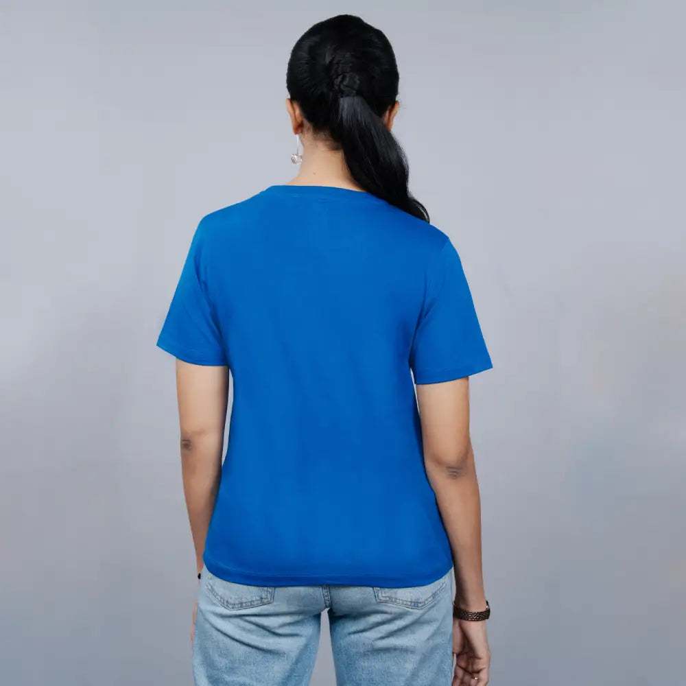 back-angle of royal blue “Guitar Girl” tee highlighting the relaxed fit and bold print