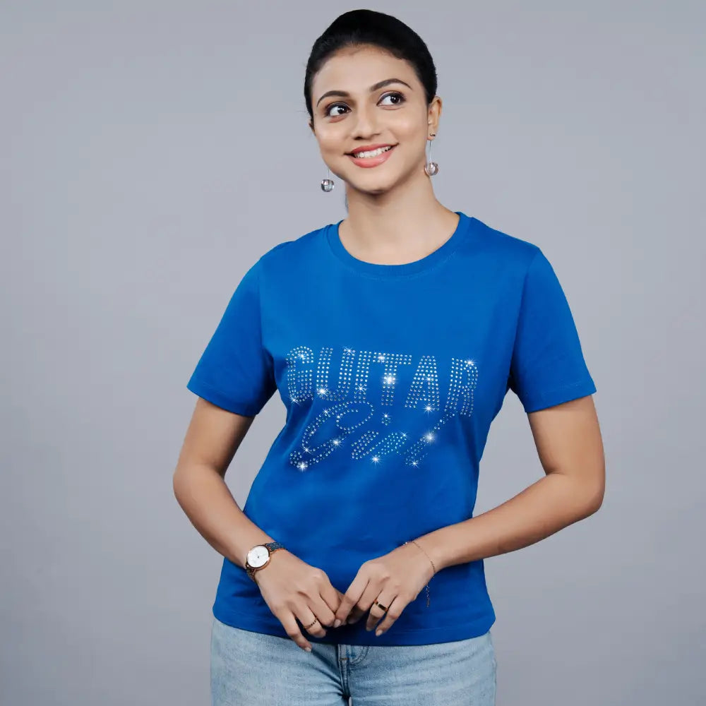Woman wearing royal blue “Guitar Girl” tee with jeans—music-mood meets everyday confidence