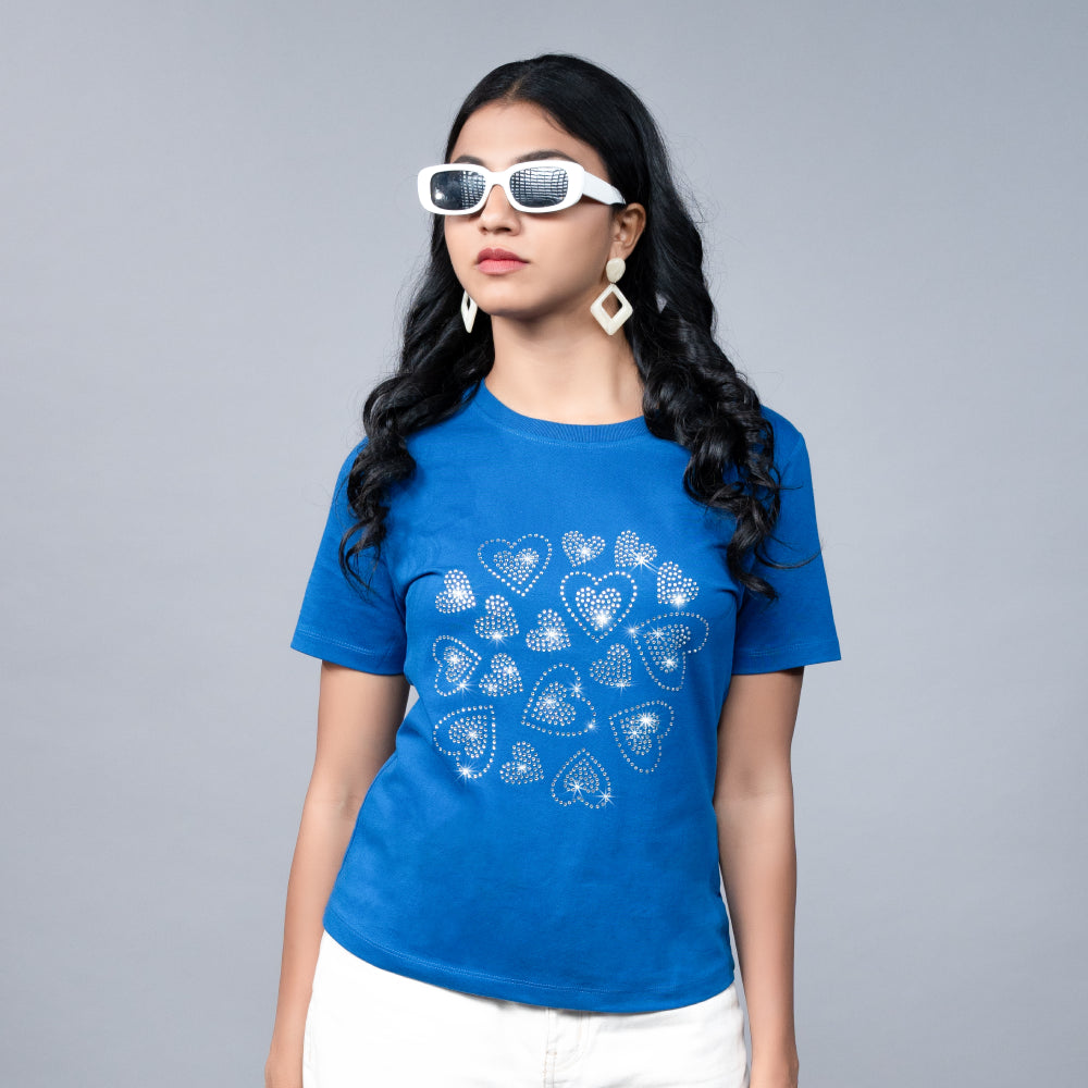 Close-up of the royal blue tee highlighting the shimmering rhinestone-heart design