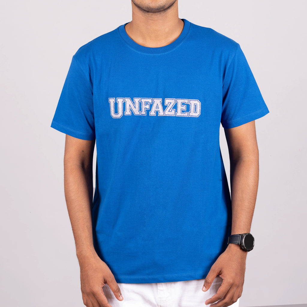 Man walking straight in UNFAZED tee—urban energy meets unapologetic style