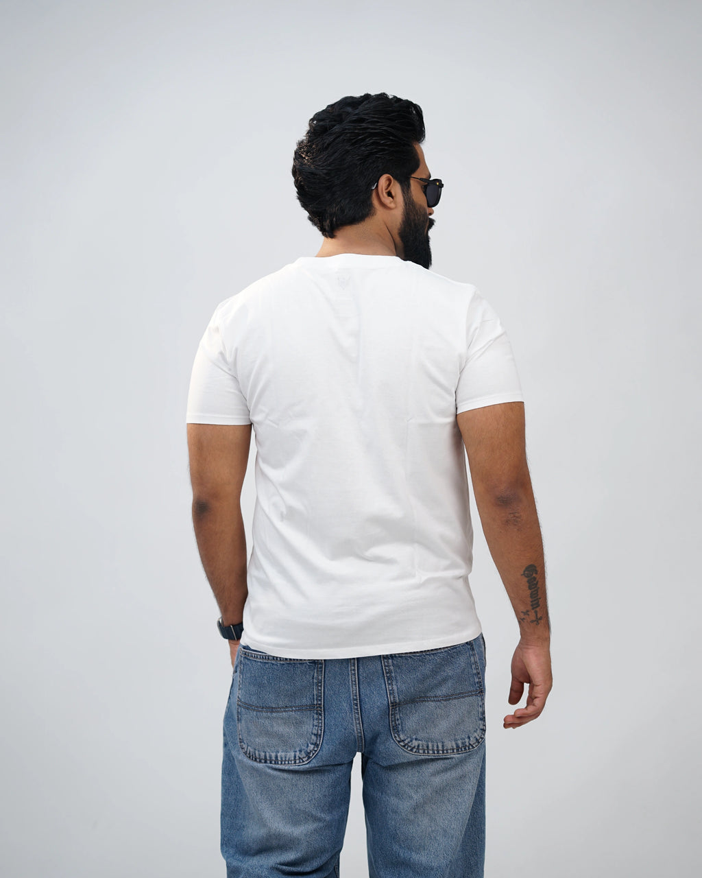 Back view of white crew-neck tee, smooth finish, and comfortable fit