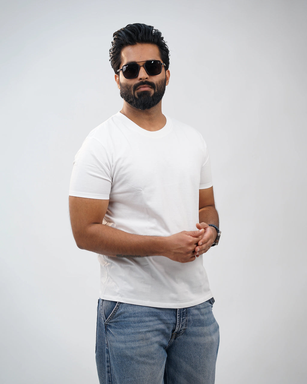 Close-up detail of neckline and soft cotton texture on white crew-neck tee