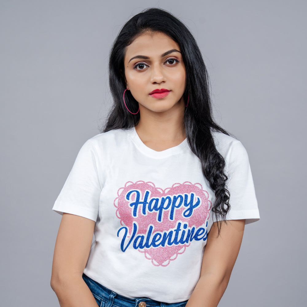 Woman wearing White 'Happy Valentine' tee styled with denim—playful romantic vibe