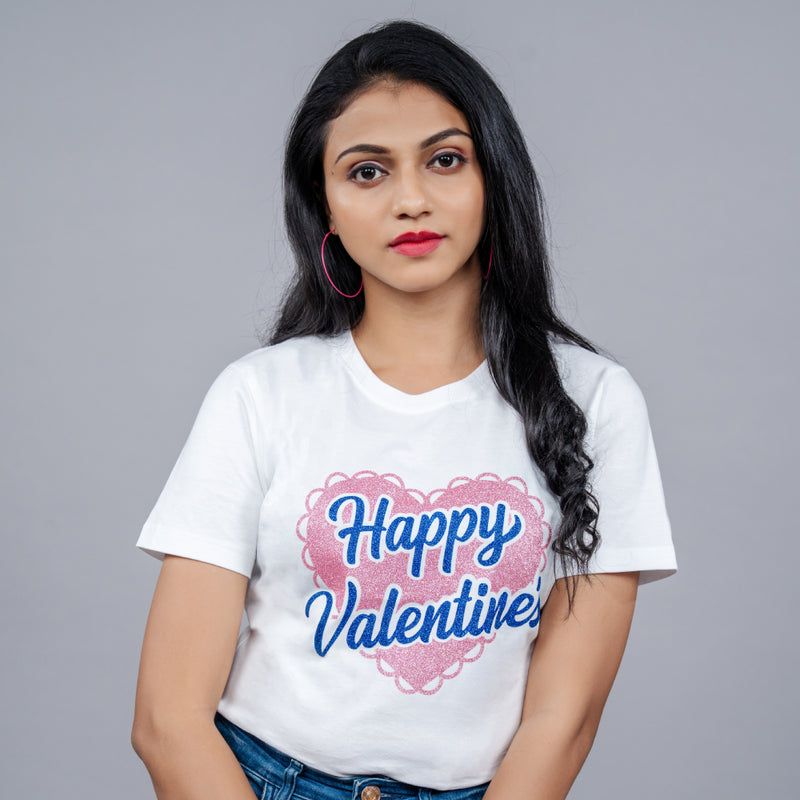 Woman wearing White 'Happy Valentine' tee styled with denim—playful romantic vibe