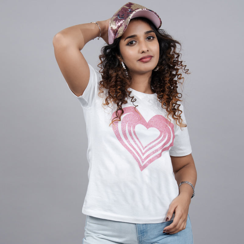 Woman wearing Heart tee styled with jeans—effortless, chic mood