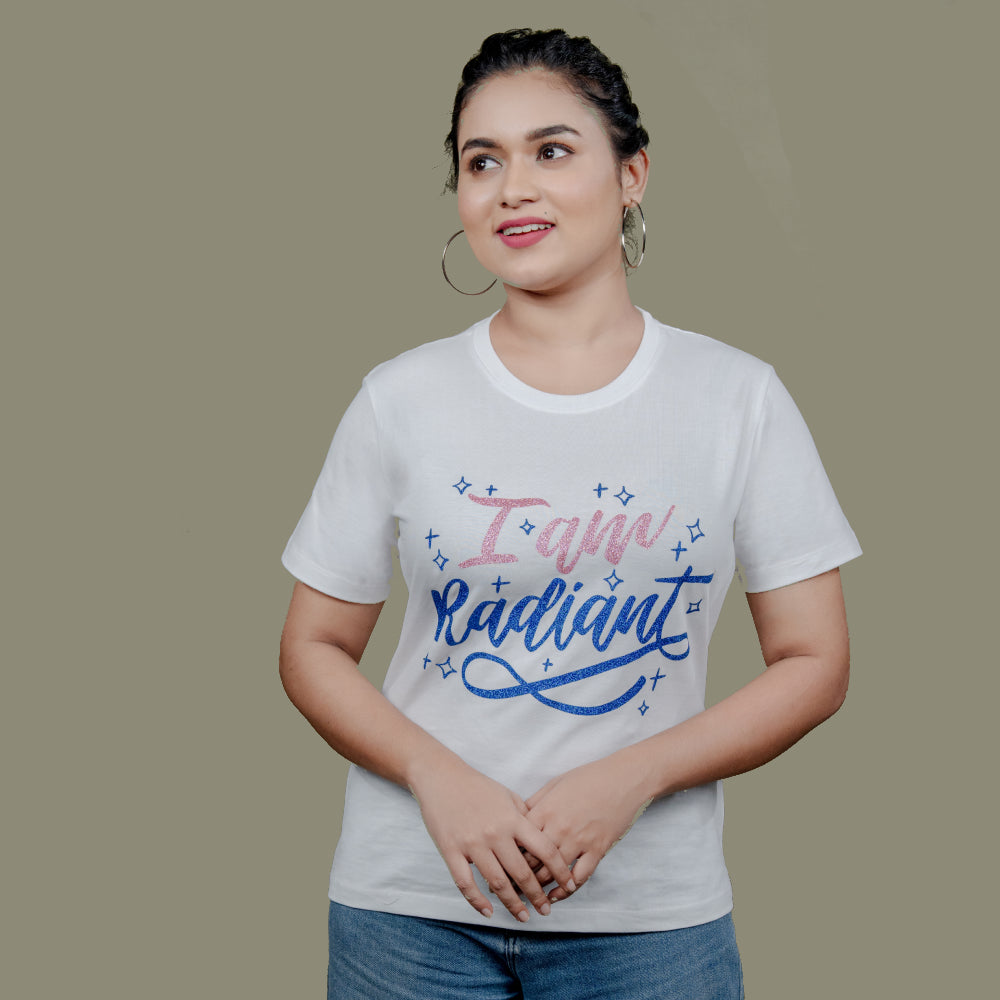 Woman wearing I Am Radiant tee styled with statement jeans—casual, confident mood
