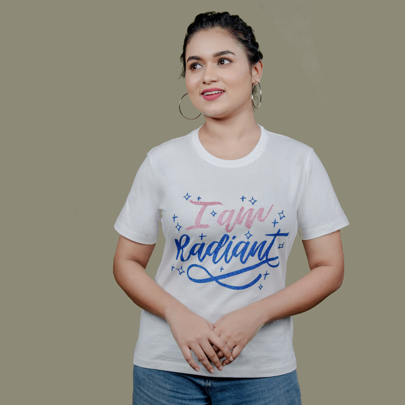 Woman wearing I Am Radiant tee styled with statement jeans—casual, confident mood
